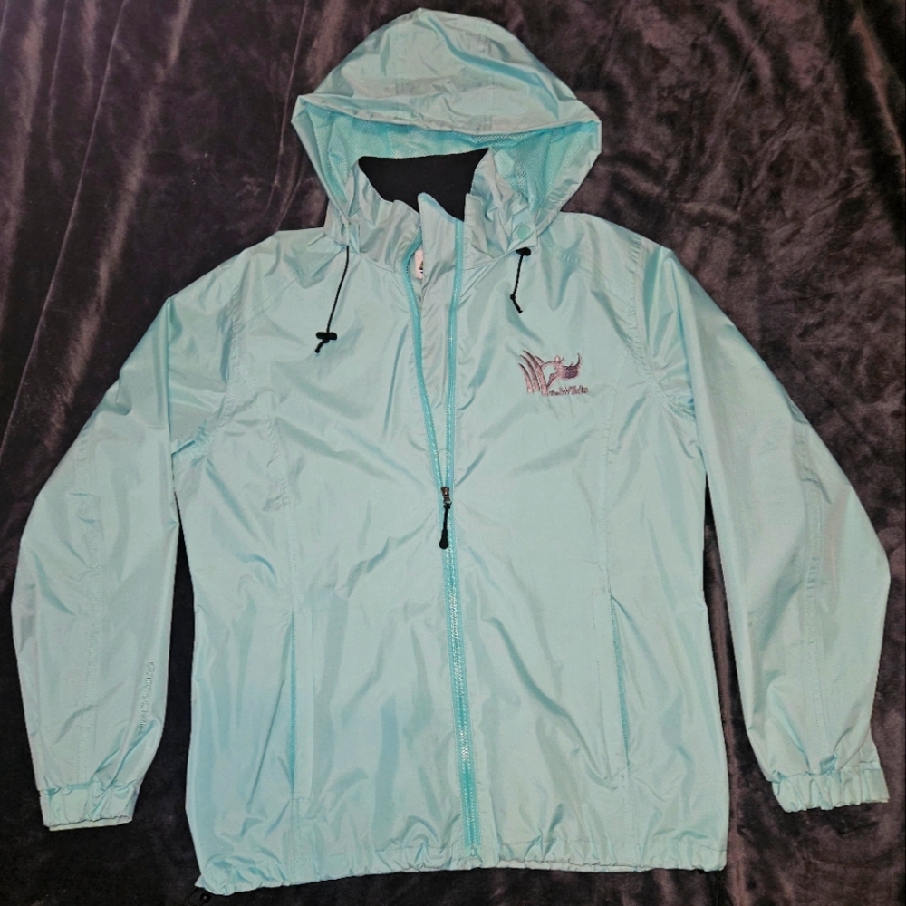 The Wilds Guide's Choice teal rain jacket